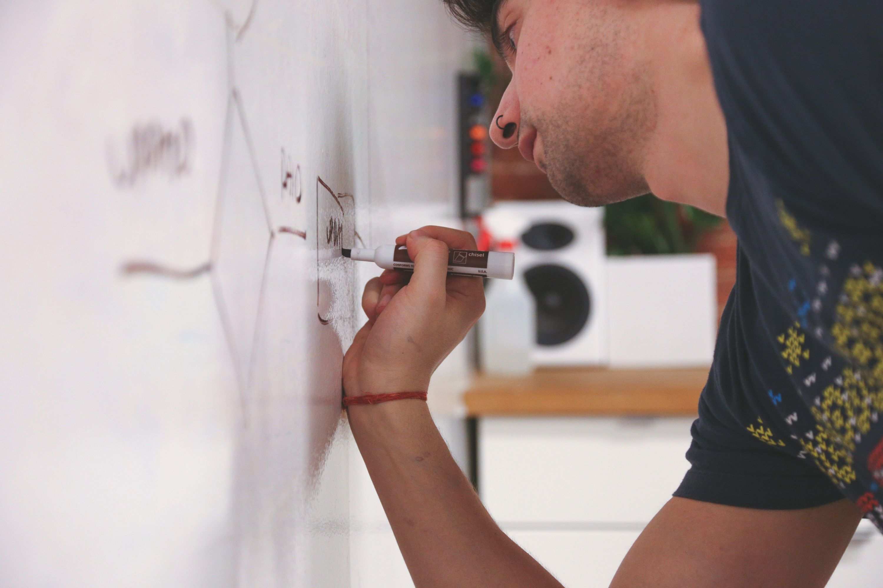 Whiteboard covered with software architecture sketches